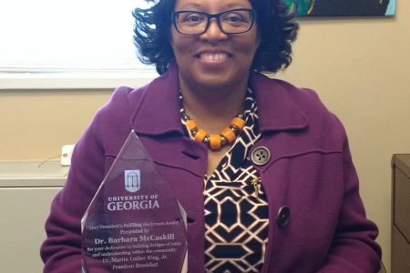 Dr McCaskill with the award