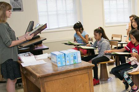 Madison Garrett leads a group of Cleveland Road Elementary School students in a writing exercise